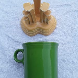 Green mug and yellow candle holder